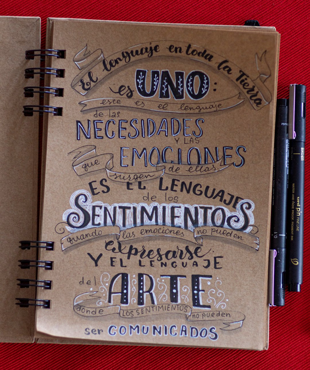 a notebook with writing on it sitting on a table